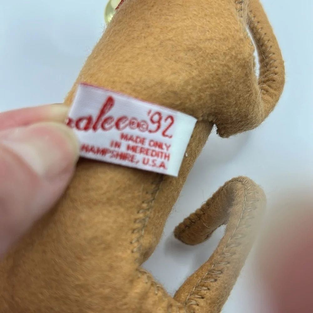 Annalee Reindeer wearing a Santa hat and bell